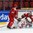 HELSINKI, FINLAND - JANUARY 2: Switzerland's Pius Suter #24 slides into Belarus' Ivan Kulbakov #31 with Alexander Tabolin #2 in front during relegation round action at the 2016 IIHF World Junior Championship. (Photo by Matt Zambonin/HHOF-IIHF Images)

